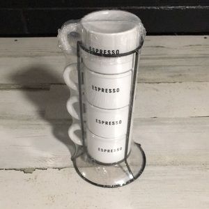 Set of four white stackable espresso cups in black wire holder new in package.